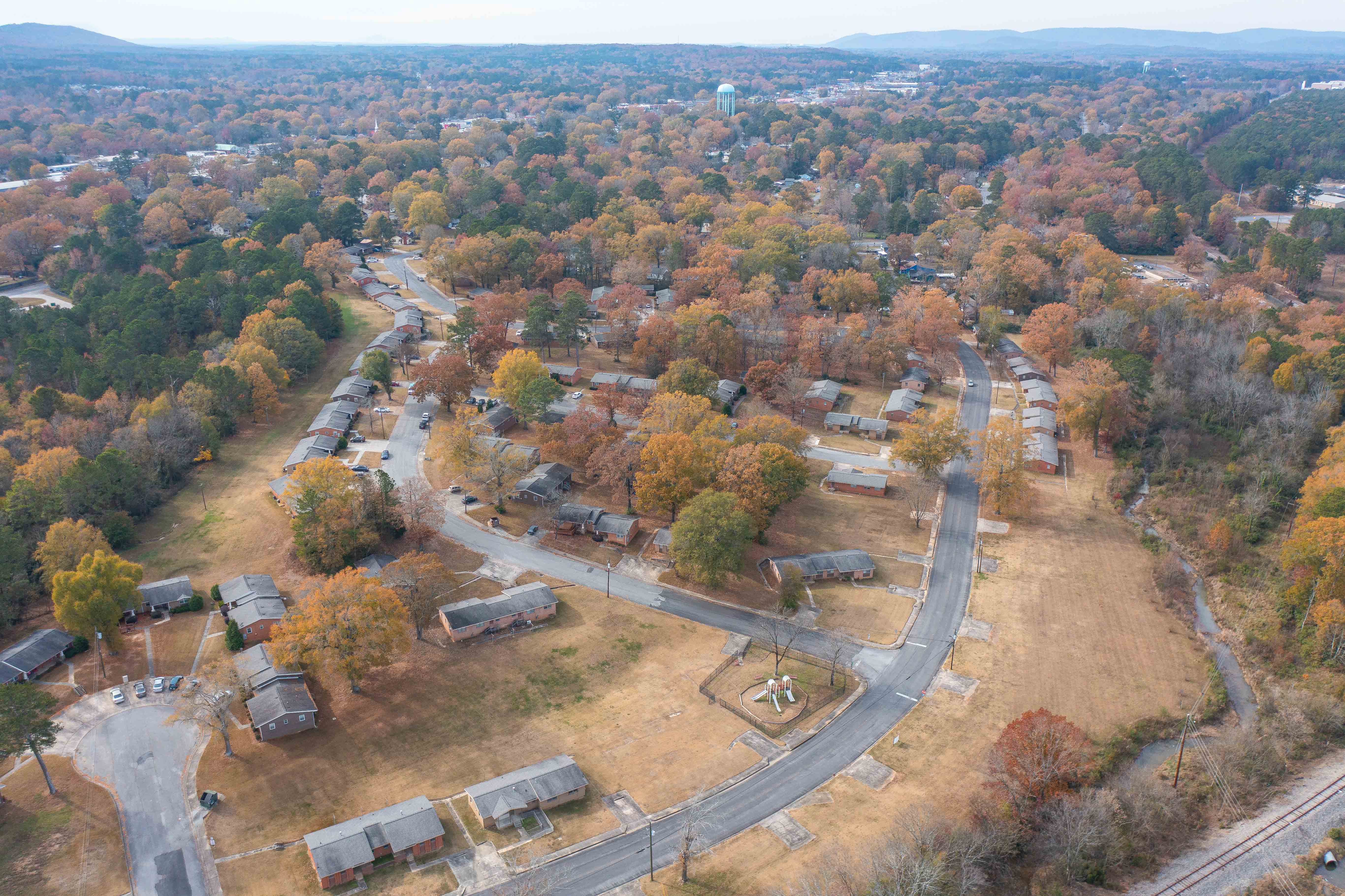 A small town with a lot of trees and houses.